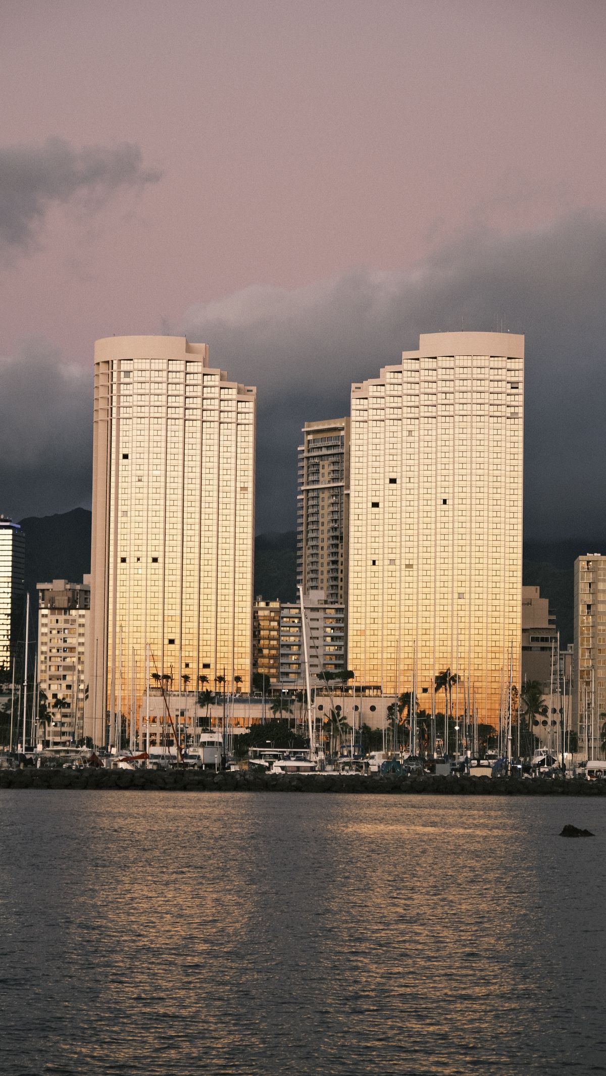 High-rise residences catching golden hour light — placeholder imagery